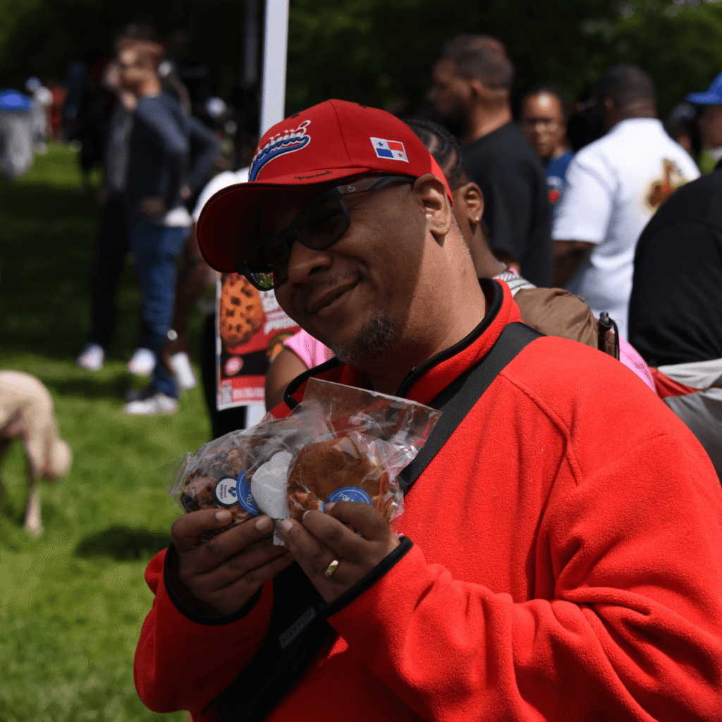 A man holding a few warm cookie from For the Love of Dough